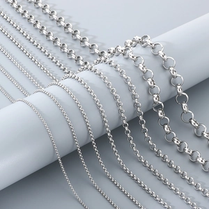 Close-up of various thicknesses of stainless steel round link chains in silver finish.