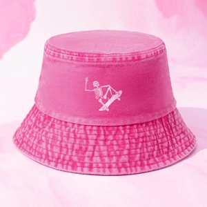 Pink acid wash bucket hat featuring white skull skateboard graphic in street style