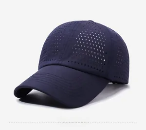 Close-up of laser-cut diamond-shaped vent holes on quick-dry dark blue baseball cap