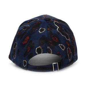 Detail of adjustable silver metal buckle on navy leopard print baseball cap back