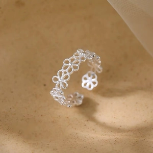 Exquisite silver hollow flower open ring with minimalist floral lace design for women