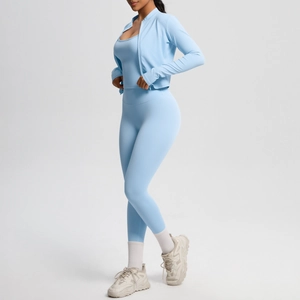 Detailed side view of light blue three-piece yoga set featuring brushed texture fabric
