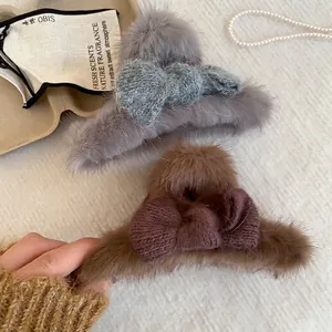 Faux fur hair claw clip with knit bow in grey blue and dark brown colors for autumn and winter