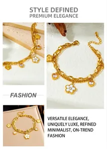 Detailed macro view of gold double-layer chain bracelet with flower and heart charms