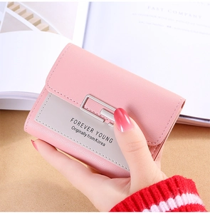 Detail of three-fold pink and grey wallet with silver metal buckle and Forever Young logo