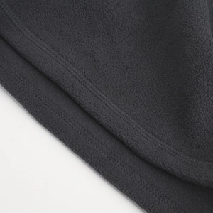 Detail of double-needle stitching on warm black fleece outdoor cycling thermal headwear