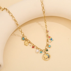 Detail of gold elephant necklace with colorful fish charms and multi-colored beads