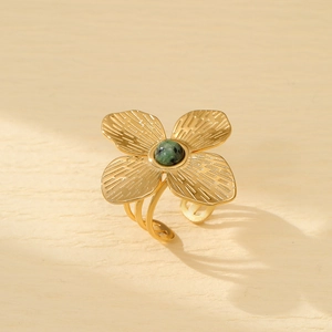 Elegant gold flower ring with a green natural stone inlay and adjustable open band