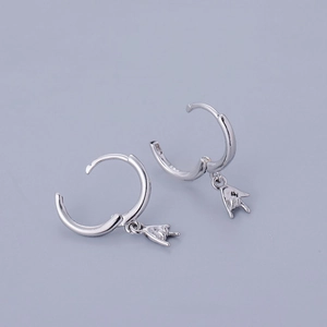 Detailed macro shot of S925 sterling silver hoop earrings with hand gesture charms
