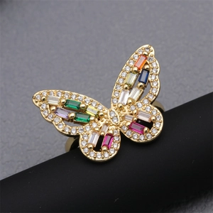 Elegant gold butterfly ring with colorful micro-pave zircons on a dark display