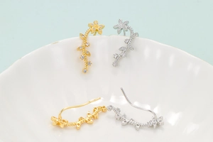 Elegant long sunflower crawler earrings with sparkling zircons in gold and silver finish