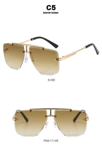 Close-up of rimless polygon sunglasses with gold metal frame and brown gradient lenses