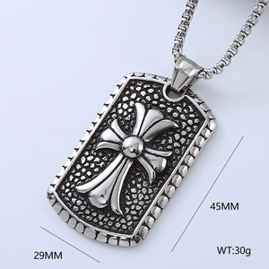 Detailed macro view of vintage stainless steel cross pendant with relief textures