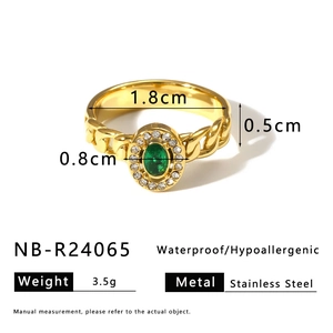 Detail view of gold-plated stainless steel ring with emerald zircon and size dimensions
