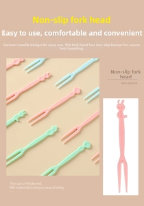 Close-up of colorful cartoon rabbit plastic fruit forks with non-slip dual tines