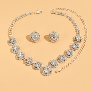 Elegant silver African bridal jewelry set with floral rhinestone necklace and earrings