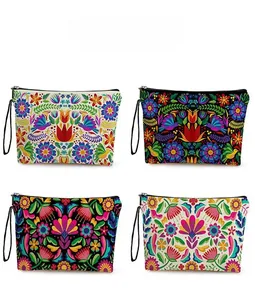 Detailed pattern display of printed canvas makeup bags with diverse ethnic floral motifs