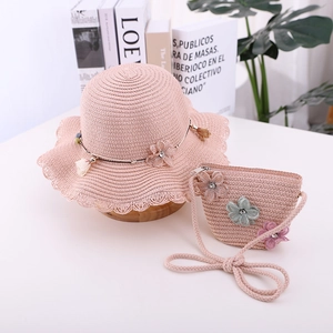 Pink straw sun hat and matching crossbody bag set with delicate floral net embellishments