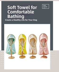 Macro view of microfiber pet hooded towels in four pastel colors with soft terry texture