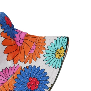Detailed view of summer sun hat featuring vibrant floral patterns and twill fabric texture