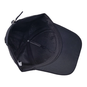 Internal structure of black cotton cadet cap showing metal buckle and inner stitching details