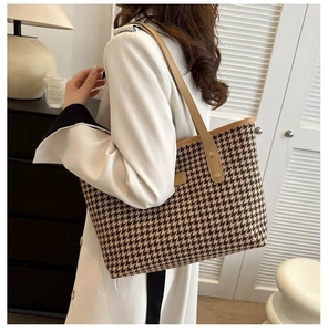 Model showing the houndstooth tote bag on shoulder for a vintage large capacity look