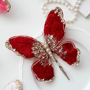 Elegant red velvet butterfly clip with pearls and gold glitter for Christmas tree decor