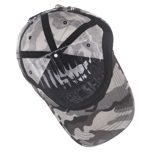 Detail view of cotton camouflage baseball cap interior with sweatband and stitching