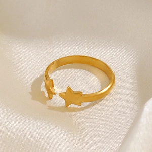 18K gold plated stainless steel star ring with an adjustable open design on silk