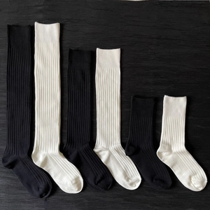 Black and white ribbed knit socks in knee-high, mid-calf, and ankle lengths set