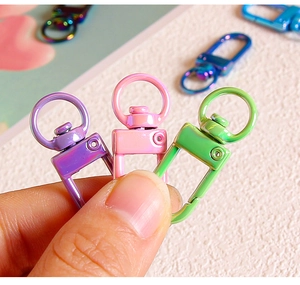 Macro shot of colorful UV-plated metal lobster clasps for DIY keychains and bag charms