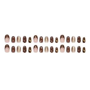 Glossy golden brown cat-eye press-on nails set with French tips and glitter accents