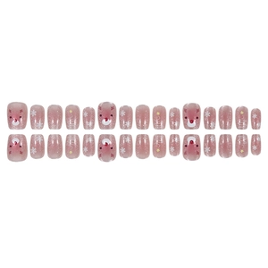 Pink Christmas press-on nails featuring reindeer, snowflakes, and festive glitter cat eye effects