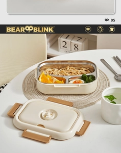 Close-up of 304 stainless steel two-compartment lunch box with secure sealing buckles
