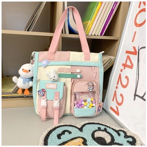 Detailed view of canvas backpack featuring a transparent pocket with colorful fuzzy balls
