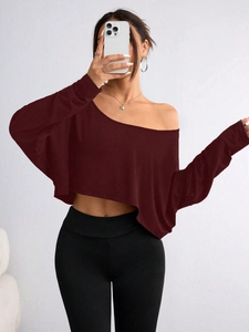 Close-up of wine red off-shoulder long sleeve top with soft ice-silk fabric texture