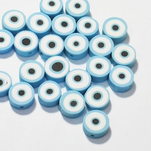 Macro shot of 10mm light blue evil eye polymer clay beads for DIY jewelry making