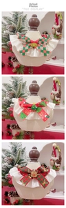 Three festive pet Christmas bow ties with reindeer, tree and bell on wooden stands