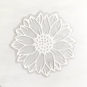 Macro shot of a transparent sunflower silicone stamp showcasing fine petal textures