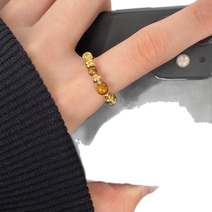 Minimalist 18K gold plated tiger eye bead stretch ring with vintage aesthetic on hand