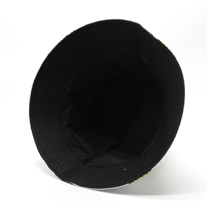 Outdoor summer bucket hat with fruit print design and black lining on white background