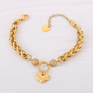 Detail of gold heart pendant bracelet with matte beads and adjustable lobster clasp