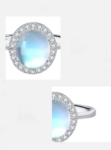 Macro shot of 925 sterling silver ring with 2 carat moonstone and pavé diamond halo