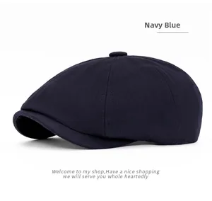 Detailed close-up of navy blue newsboy cap with classic herringbone texture and top button