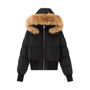 Detailed view of women's black hooded puffer jacket with faux fur trim and ribbed cuffs