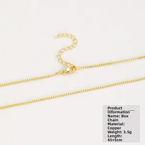 Detailed view of a gold-plated box chain necklace with a lobster clasp and extension