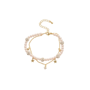Double-layer gold bracelet with pink pearls, sparkling zircon stars and dainty metal chains