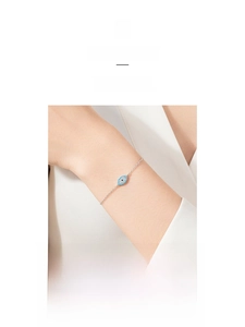 Detailed view of S925 sterling silver evil eye bracelet with blue and white crystals