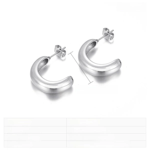 Detailed macro view of 22x7mm C-shaped stainless steel stud earrings in polished steel finish