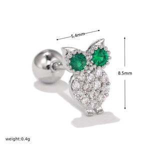 Detail view of owl stud earring with green eyes and white zircon stones 8.5mm
